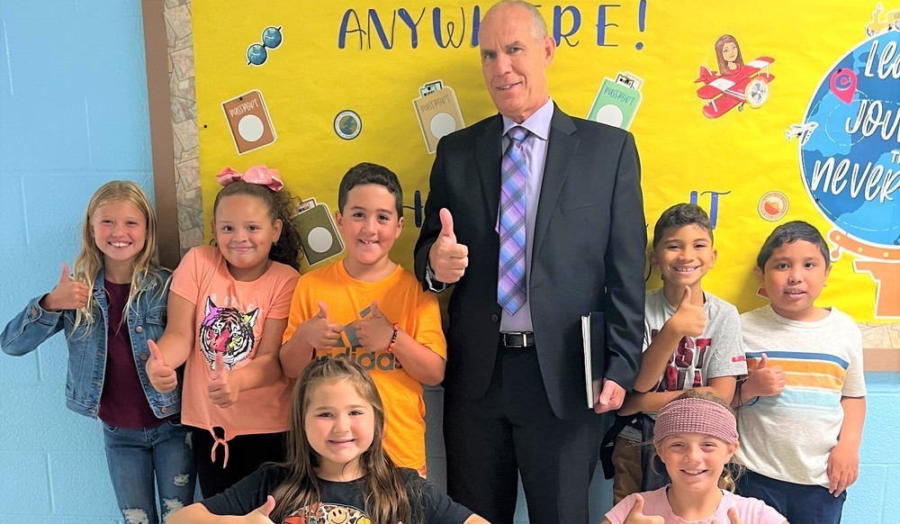 Superintendent with Grade 3 students