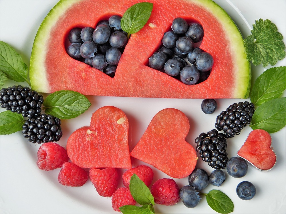 Watermelon with hear cut outs, filled with berries and mint
