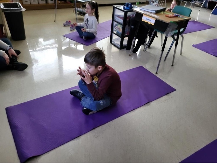 During The Great Kindness Challenge some of our Stony Brook students showed off their I Am posters and also took a nice breathing break with some yoga.  Students seating on the floor mat doing yoga 
