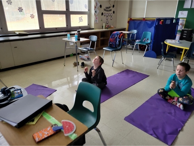 During The Great Kindness Challenge some of our Stony Brook students showed off their I Am posters and also took a nice breathing break with some yoga.  Students seating on the floor mats doing yoga , meditating 