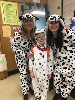 Photo of a student and teachers Celebrating 101 days of learning at Birchwood Elementary with a Dalmatians dress up theme