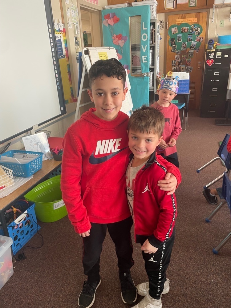 Photo of two students posing for the camera crafting Kindergarten celebrated the 100th day of school with their 5th grade buddies. #SBhasHEART