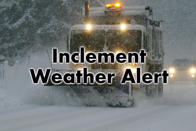 A snow plow in a storm showing the words Inclement Weather Alert